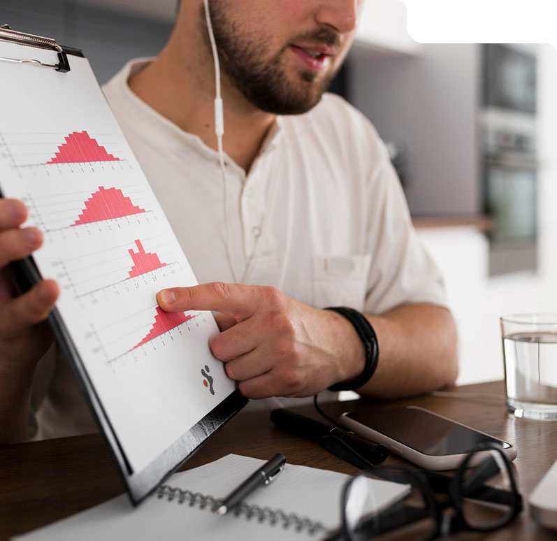 Business analyst presenting cost reduction data on a chart using AI-driven insights